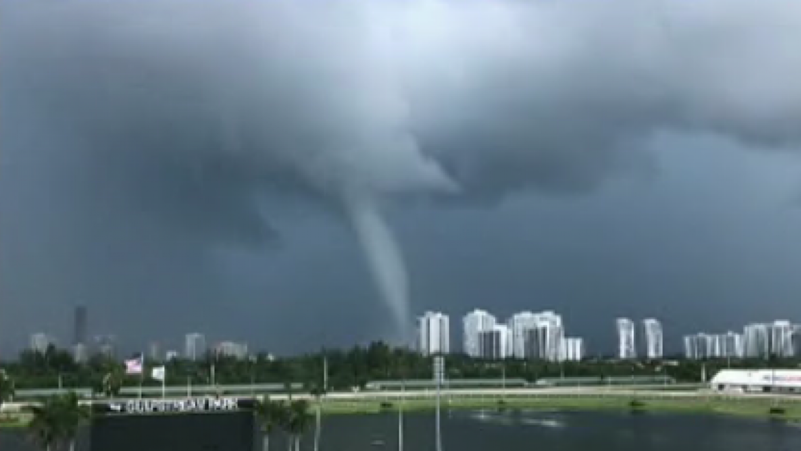Waterspout slides up South Florida beach: