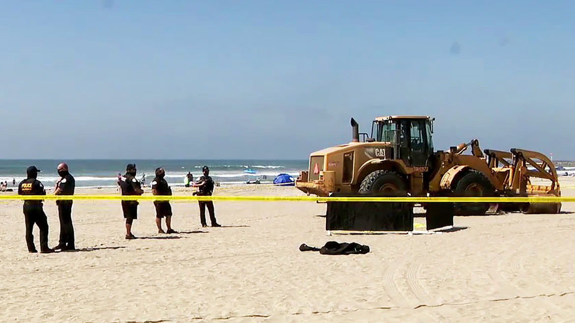 Woman crushed to death while lying on beach