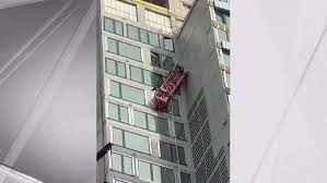 scaffold collapse rescue at NYC high rise, follow News Without Politics, stay informed unbiased