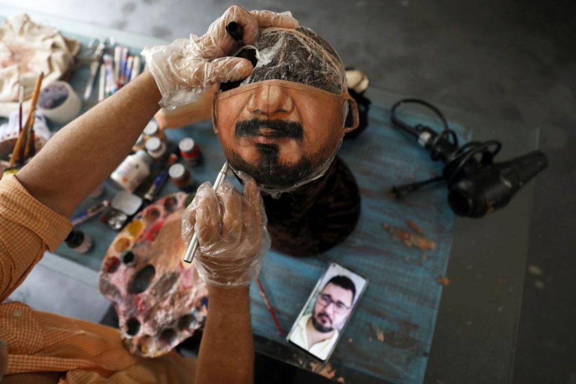 Brazil artist paints masks to show a person’s face