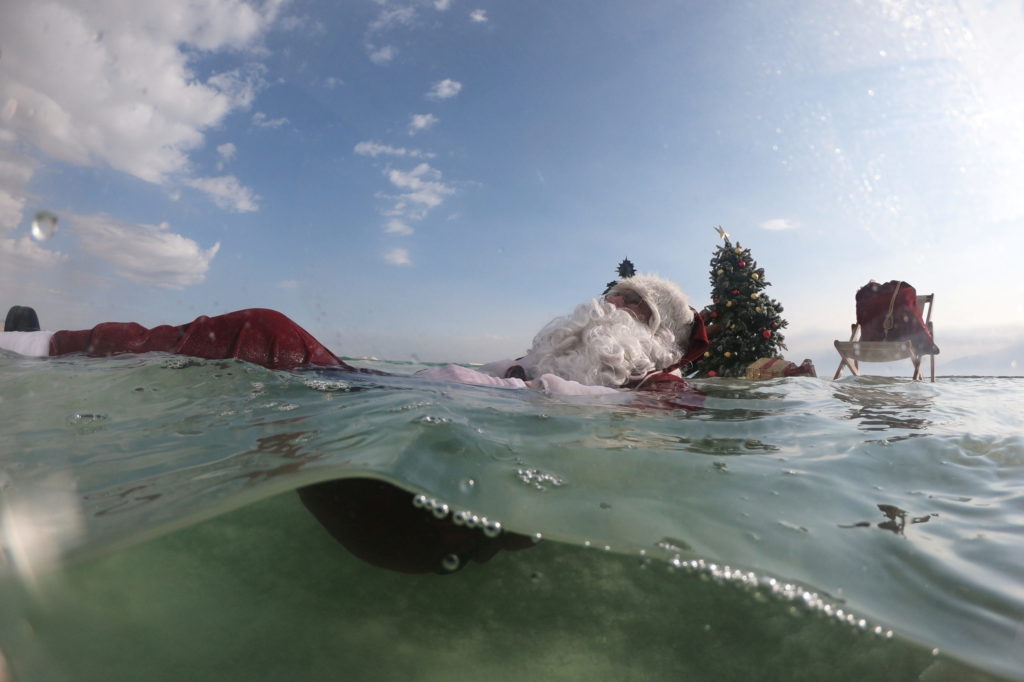 Swimming Santa brings Dead Sea to life! With tree and cheer, follow Santa from News Without Politics, no politics, news unbiased