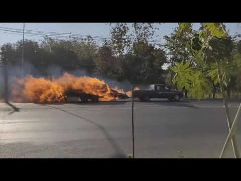 Truck towing flaming trailer speeds through town, hay, Thailand, follow News Without Politics, most news other than politics, world news