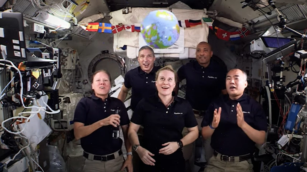 Astronauts from space with zero gravity ball drop