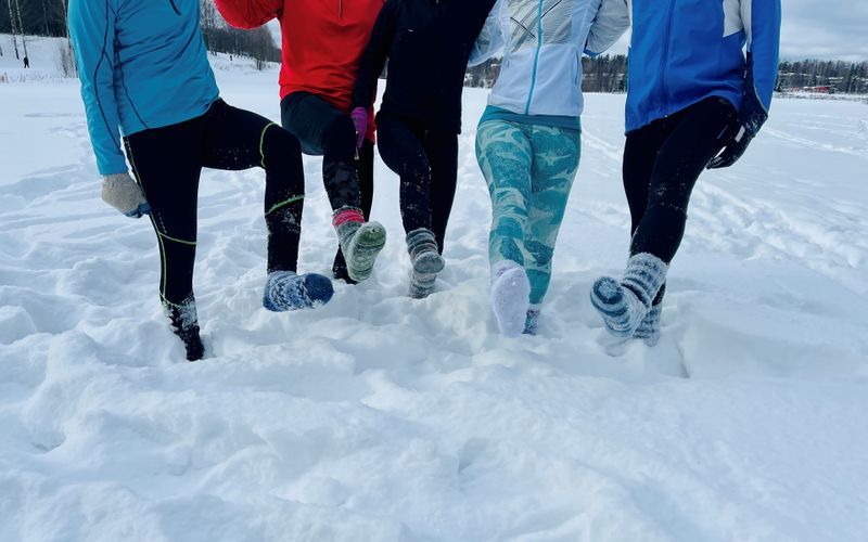 Finnish runners wear only socks in deep snow