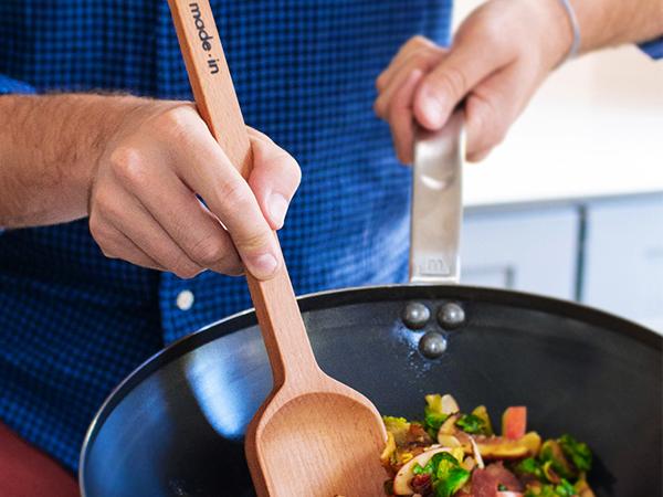 Why should you cook with a wooden spoon?