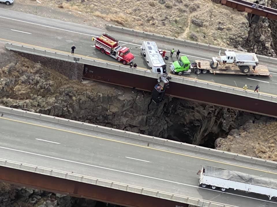 Rescue: truck dangles over bridge-driver loses control