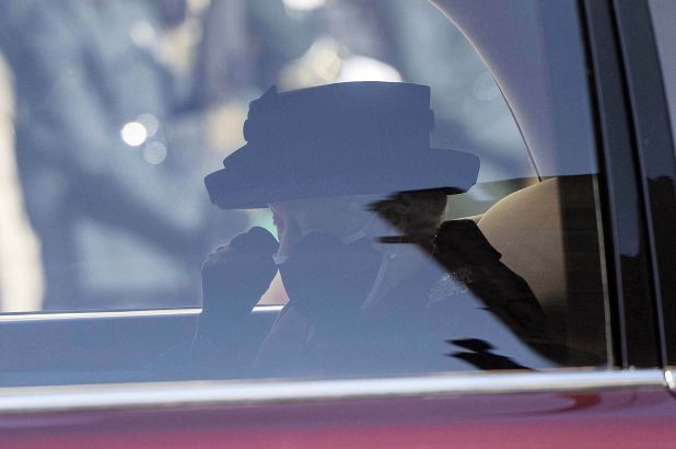 Queen Elizabeth captured dabbing her eye at Prince Philip’s funeral