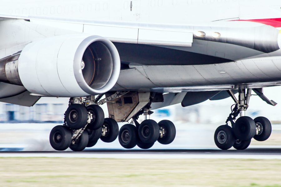 Man hides on the landing gear of a plane
