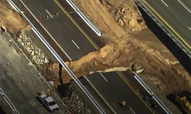 California freeway cut in half by raging floodwaters